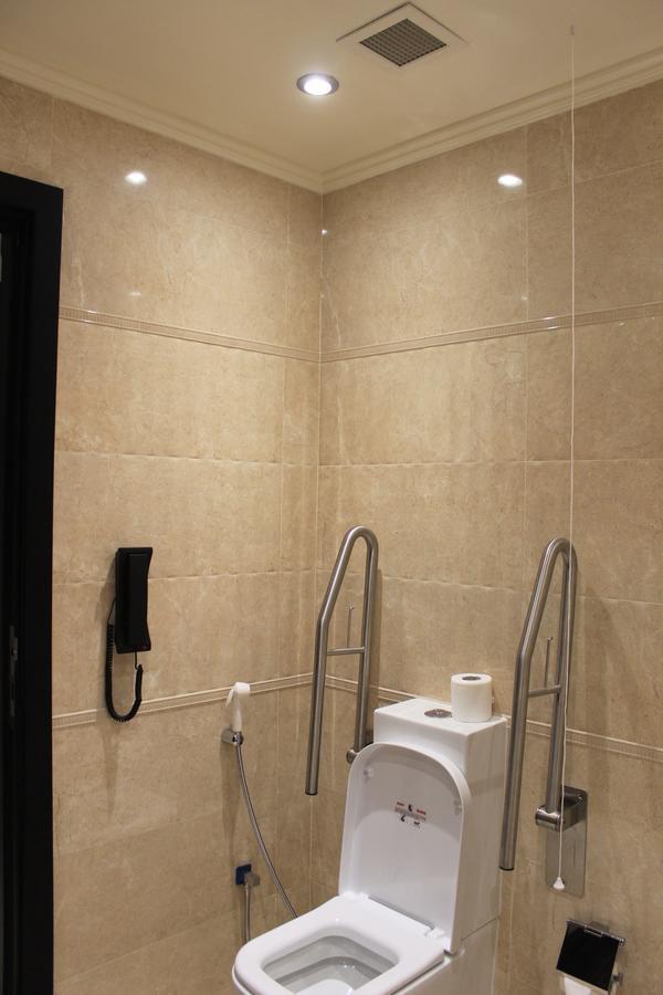 Tio Sea Resort Al Khor Exterior photo A toilet with a grab rail